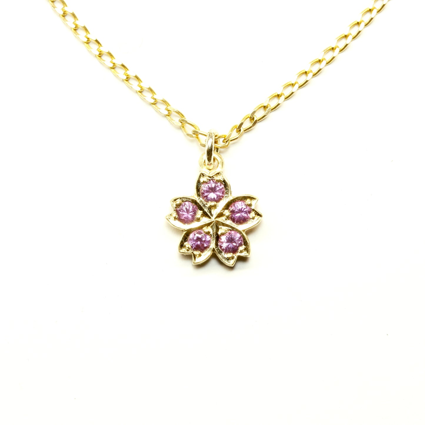 Gold & pink sapphire cherry blossom pendant in gold