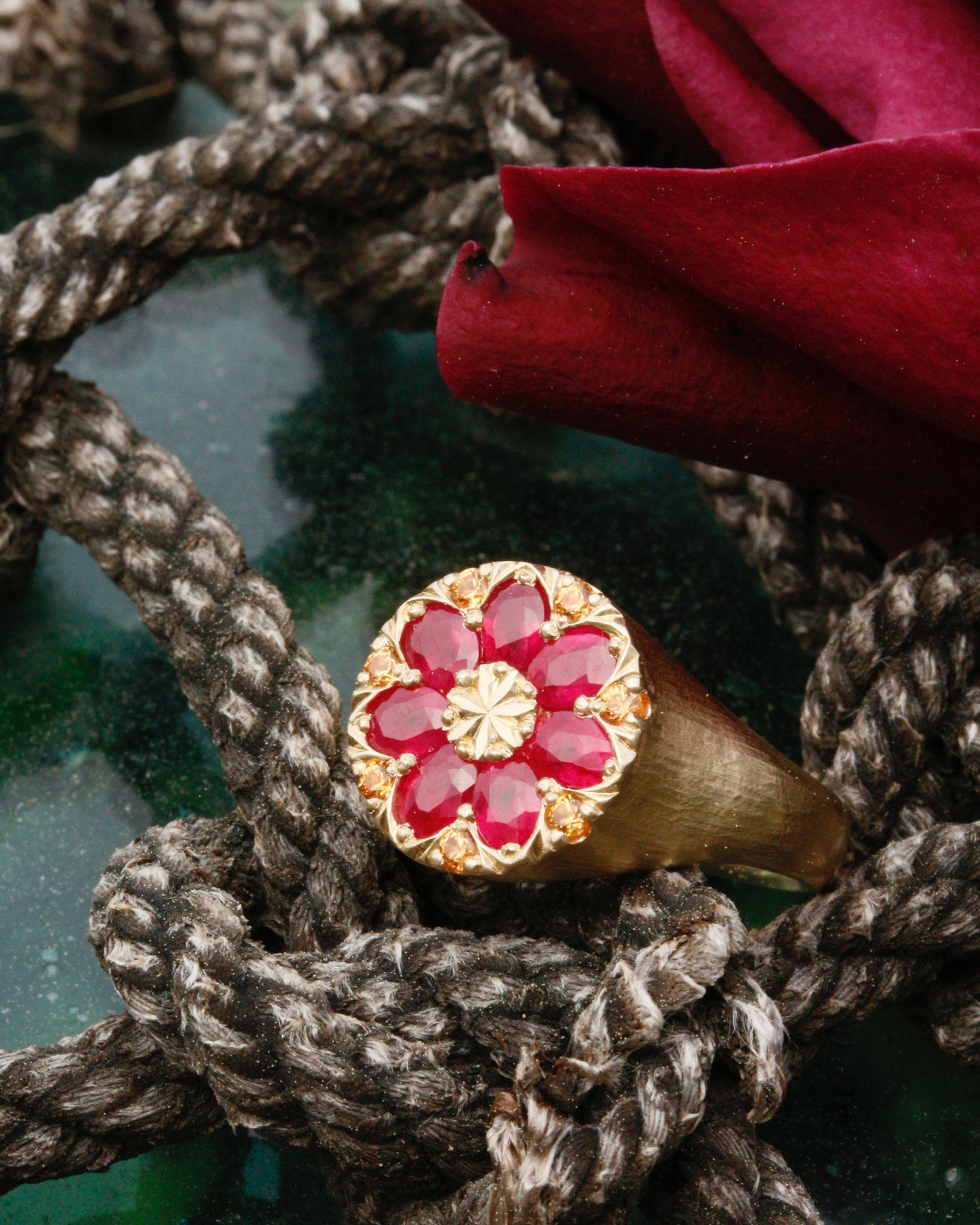 Gold kaleidoscope signet ring with natural rubies and golden sapphires