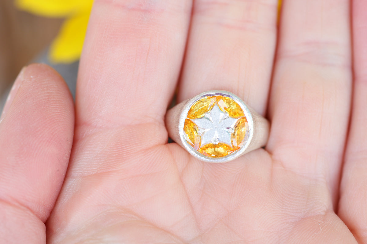 Buoyant ring in yellow sapphires