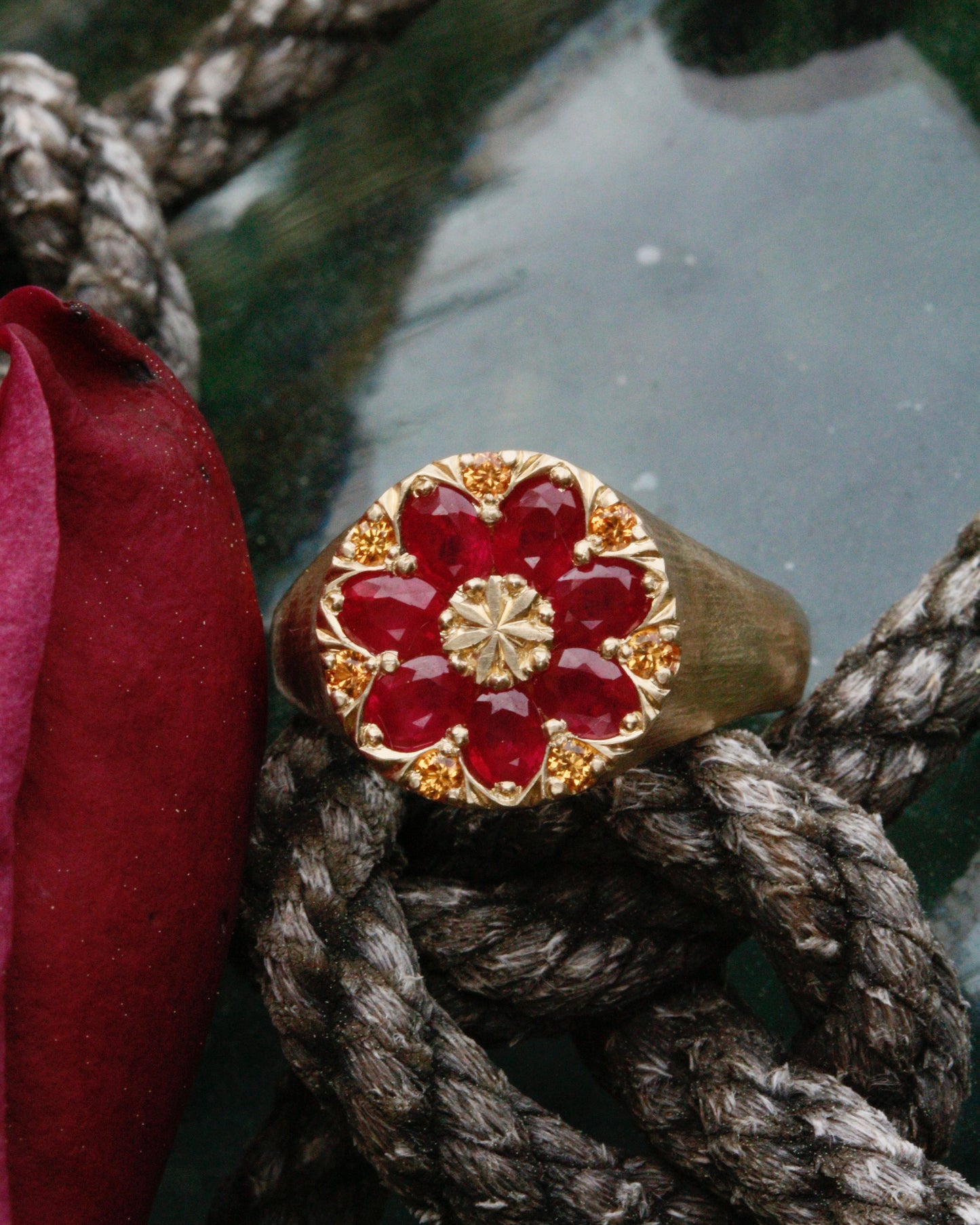 Gold kaleidoscope signet ring with natural rubies and golden sapphires
