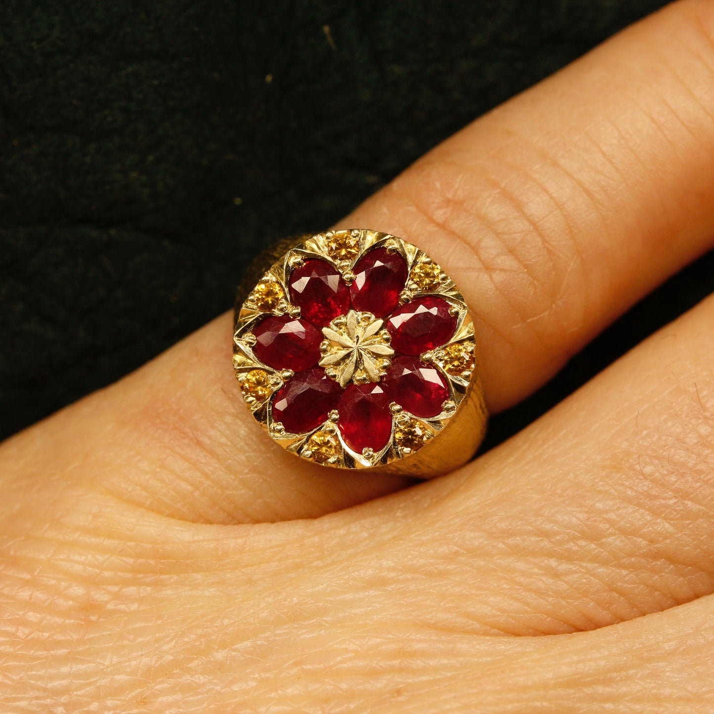 Gold kaleidoscope signet ring with natural rubies and golden sapphires