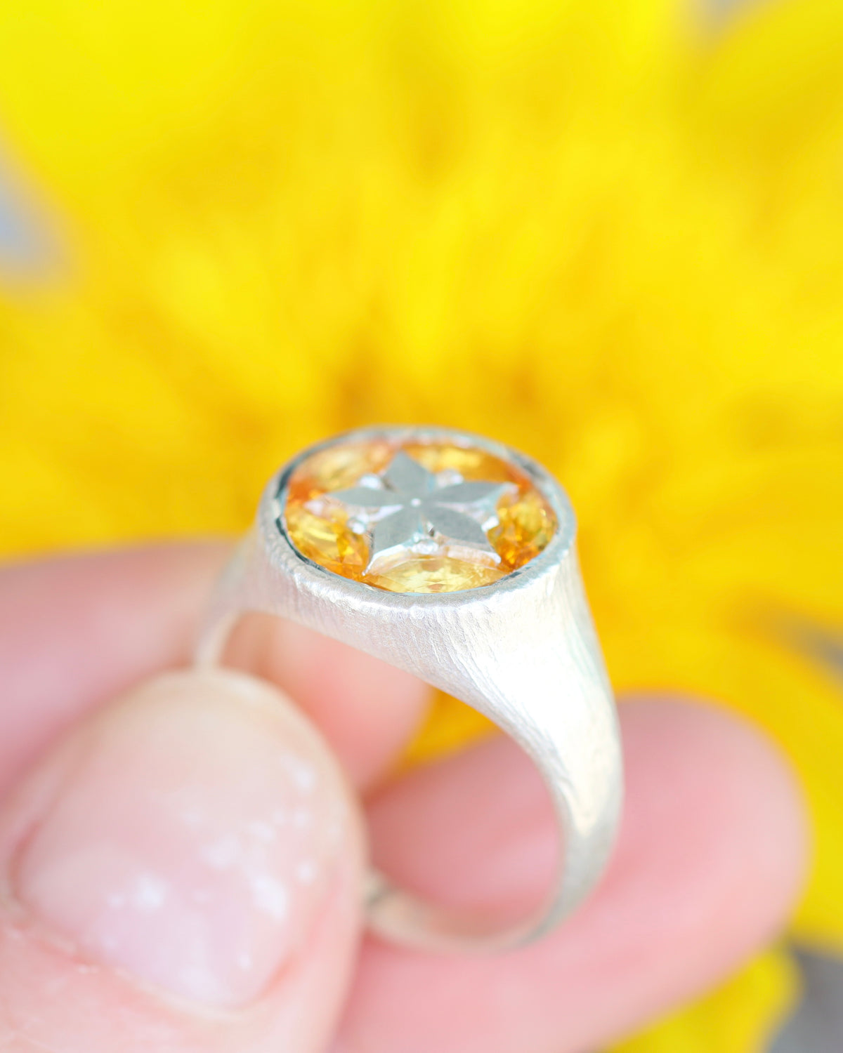 Buoyant ring in yellow sapphires