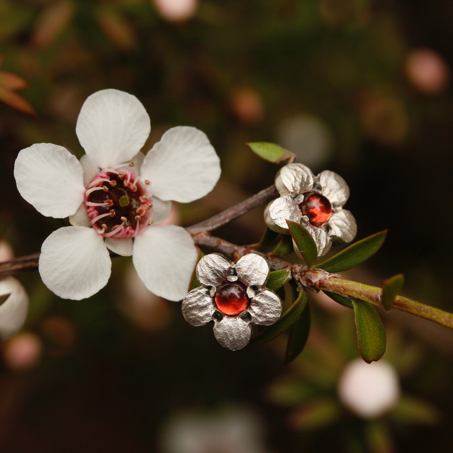 Mānuka studs with garnets