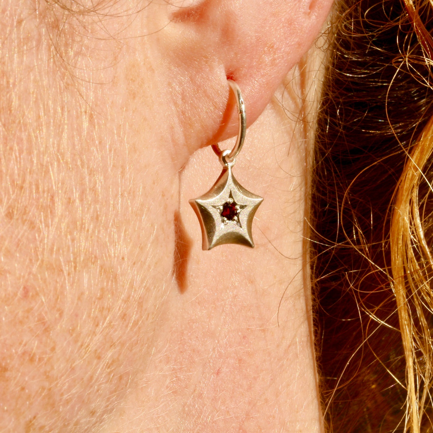 Garnet wishing star earrings
