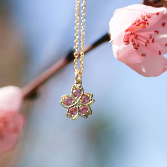 Gold & pink sapphire cherry blossom pendant in gold